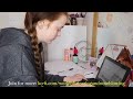 Girl sneezing while studying
