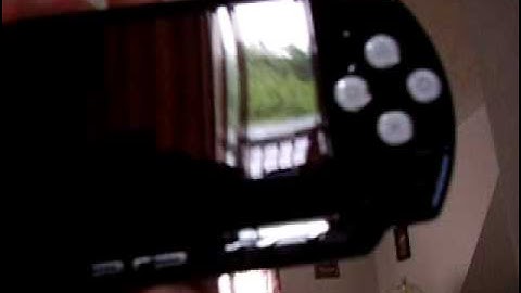 psp 3000 with custom white buttons.