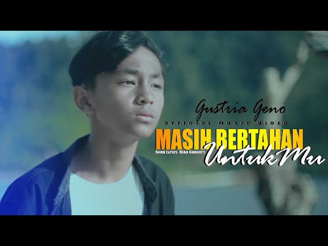 Gustrian Geno - Masih Bertahan Untukmu (Official Music Video) Bodohnya Diriku Masih Bertahan Untukmu class=