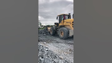 SDLG Wheel Loader DH17c2 Pushing Rock Stone To Backfill In Lake On Construction.