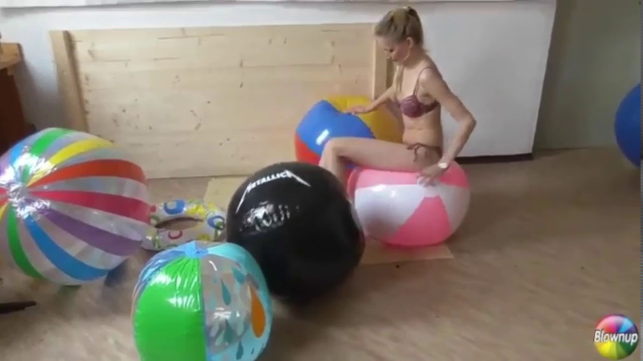Jolene is Deflating many big beach balls.