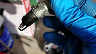 Oil on spark plug threads.