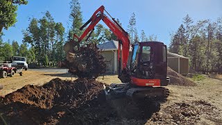 Trees Stumps & topsoil with the Kubota KX 040 4 excavator