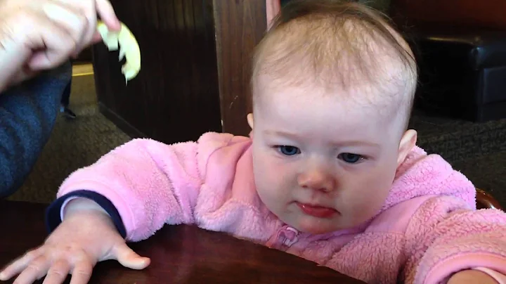 Hazel trying a lemon