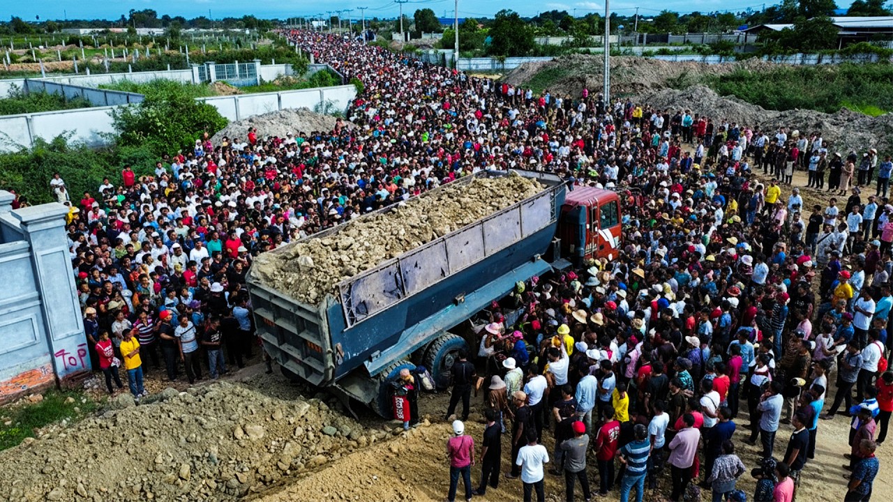 Nice skill bulldozer and dump trucks clearing and pushing soil for foundation road