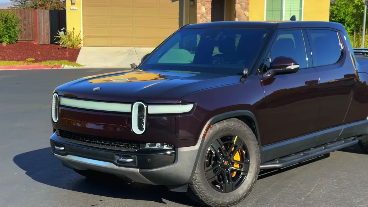 Rivian R1T wrapped in Flowing Black Charming Red color PPF by