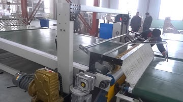 Computerized delivery stacker for corrugator production line.