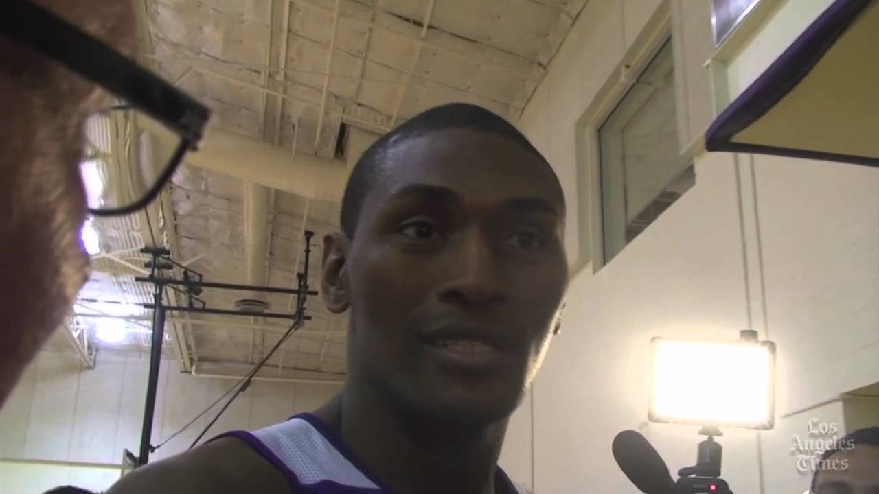 Lakers forward Metta World Peace charges into Times reporter Mark Medina