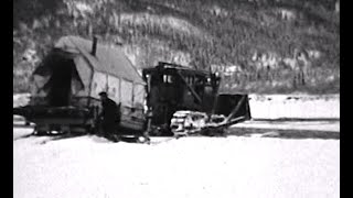 Cat trains on the Stampede Trail, circa 1940s
Mining engineer Earl Pilgrim filmed these scenes, which include bulldozers and several Cat train operations on the Stampede Trail from Lignite to Stampede in Interior Alaska, circa 1940s. In these highlights from the film, Cat trains make their way across roadless terrain, crossing rivers and hauling ore. Ore is unloaded onto an Alaska Railroad flatcar at Lignite. Also pictured are an unidentified woman feeding Earls malemute Kobuk, and Stampede mine operations including the emptying of ore cars (Color/Silent/16mm film).
These scenes are highlights from AAF-744 of the Earl Pilgrim Collection held by the Alaska Film Archives, a unit of the Alaska and Polar Regions Collections & Archives Department in the Elmer E. Rasmuson Library, University of Alaska Fairbanks. For more information please contact the Alaska Film Archives.
The Alaska Film Archives appreciates your support. Your donation in any amount will help us continue important preservation work. Please visit the “About” section of our YouTube channel to learn how you can help today. Thank you! For more information please contact the Alaska Film Archives. Cat trains on the Stampede Trail, circa 1940s