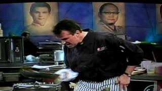 guy on iron chef sauteeing with crazy faces