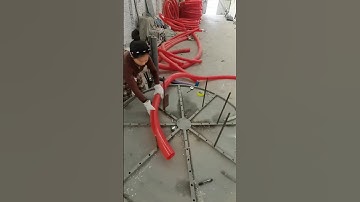 Screw conveyor hose coiling process