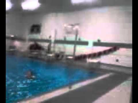 Tyler harrington jumps in pool.