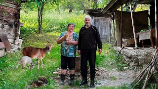 Happy old age of an elderly couple in a mountain village far from civilization