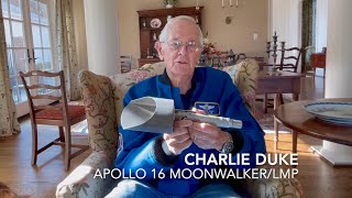 Charlie Duke holding the Apollo 16 Lunar Scoop