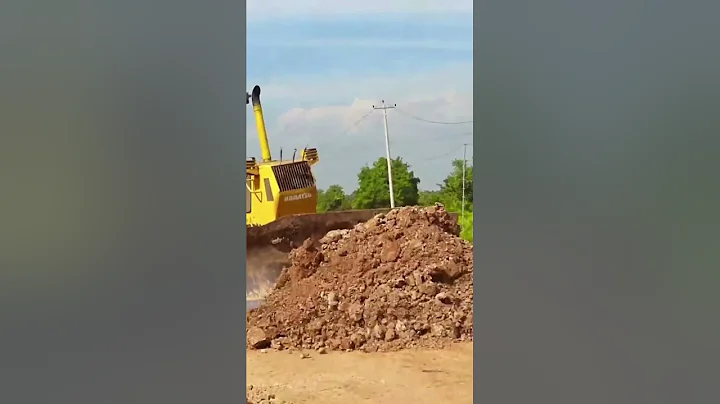 Big bulldozer mega machine working hard to build a new road project with the huge dump trucks #1007