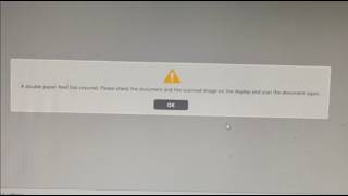 A double paper feed has occured. Please check the document and the scanned image on the display