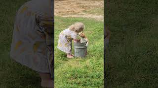 Little Girl Gives Dirt Bath to Dog!