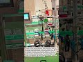 This is the process of installing bottle caps, which is done completely by an automatic machine.