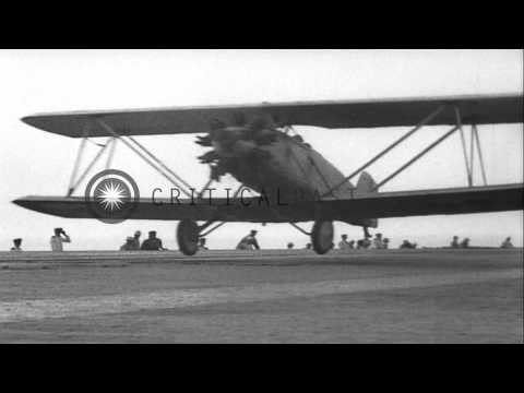 Aircraft carrier USS Langley (CV-1) at sea.  Aircraft taking off from the Carrier...HD Stock Footage