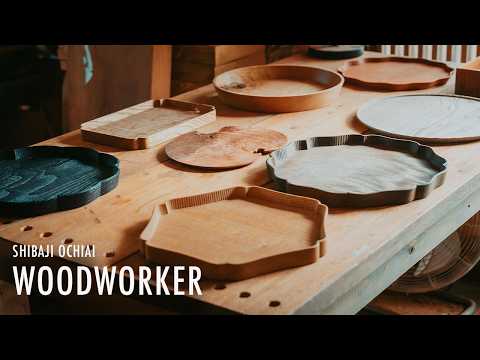 A woodworker carving trays from unknown native woods, revealing