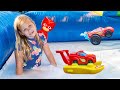 Assistant Plays with Paw Patrol in a Inflatable Bounce House Slip n Slide