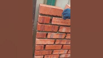 Installing red bricks so that they are even and straight following the provided thread #construction