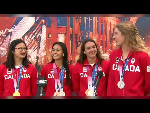 Canadian Olympic swimmers back home