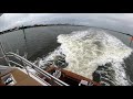 B-Roll: Dolphins Jumping Wake Behind a Viking 65 Convertible - ICW Daytona, FL