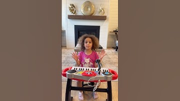 Sierra teaches Rhia to read and follow instructions to build a piano toy