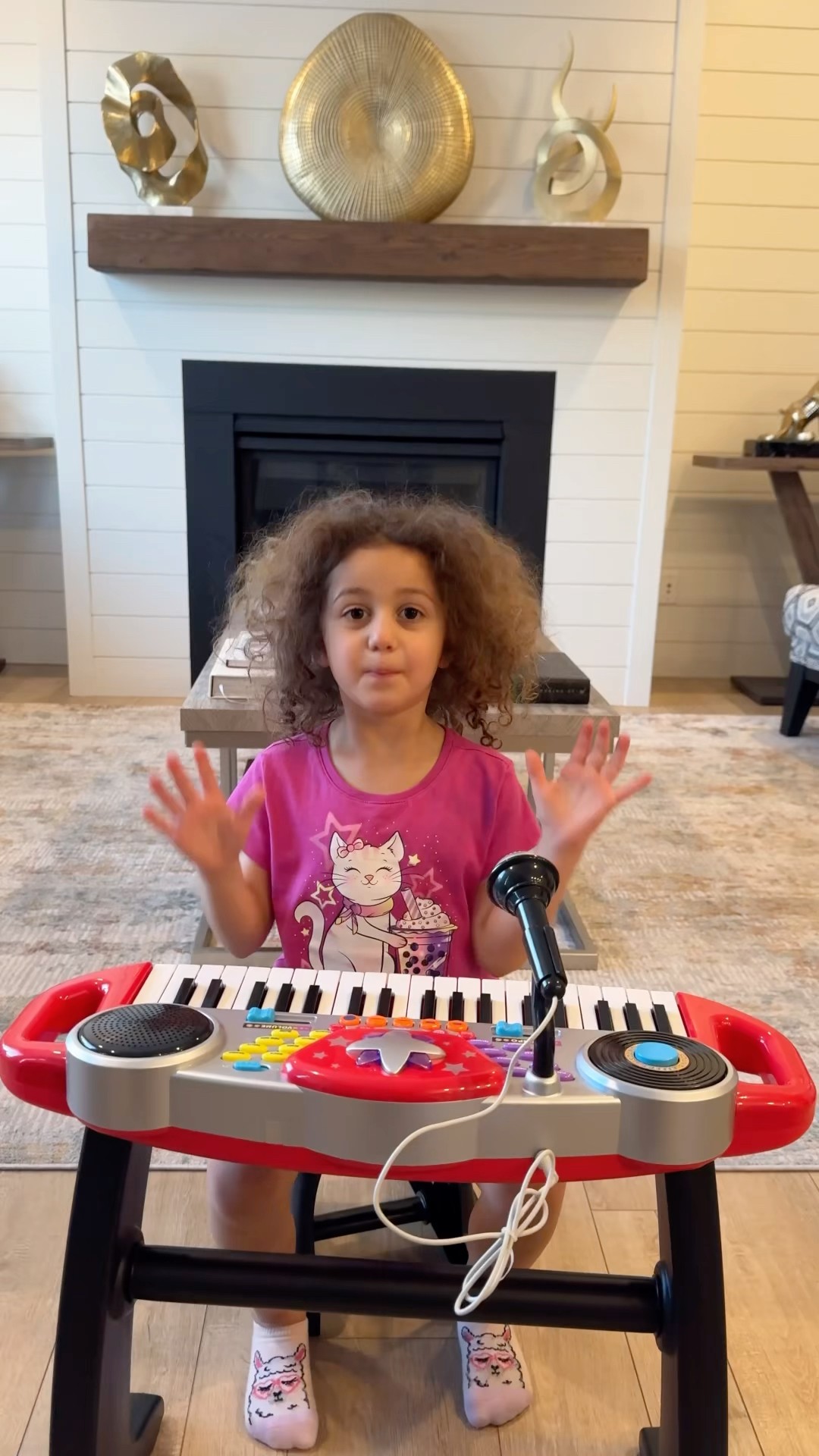 Sierra teaches Rhia to read and follow instructions to build a piano toy