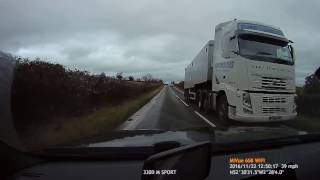 UK Bad Drivers : Corsa cuts up HGV in near miss.