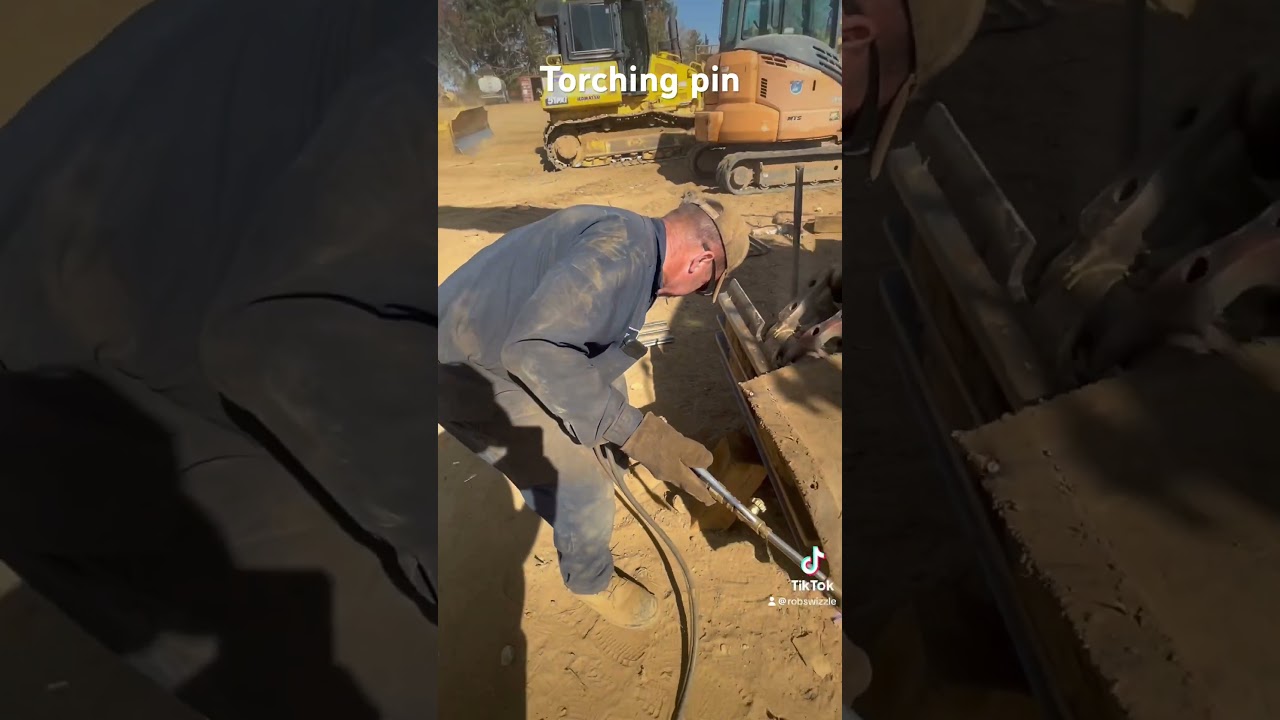 Torching pin on Komatsu track 