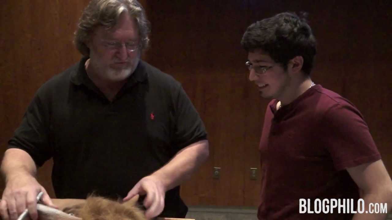 Gabe newell showing excitement with three fingers raised