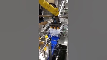 Milk bottle automatic sorting feeding robot hand cartoning machine encasing line testing video