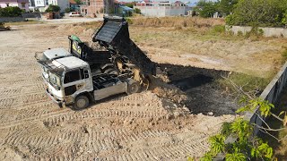 Fantastic Landfill Up Nice Bulldozer Operator Push stone and unloading stone from dump truck