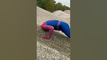 Thumbnail of Spiderman’s Head Stuck In Sand