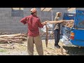 Helping the videographer for the roof of the house: a brotherly helping hand