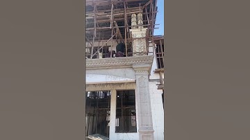 Roman columns, spiral staircases, eaves lines, and steel bar binding are being constructed