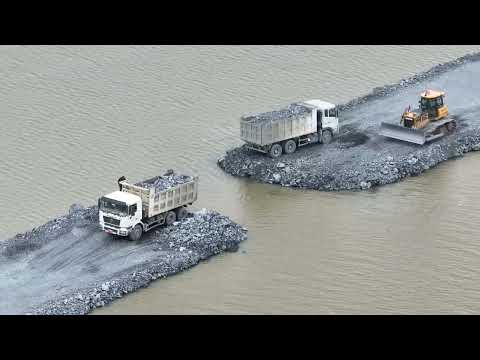 Contact Construction of a road across the lake is almost , dozer Pushing Stone & Truck 25.5Ton 