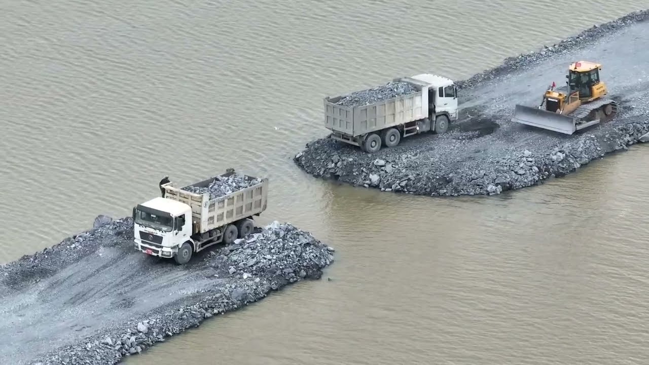 Contact Construction of a road across the lake is almost , dozer Pushing Stone & Truck 25.5Ton 