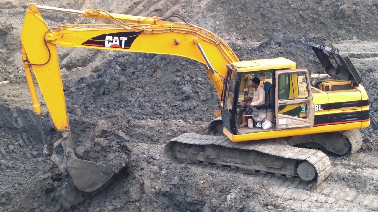 Caterpillar Excavator working time time on the Morichap River in