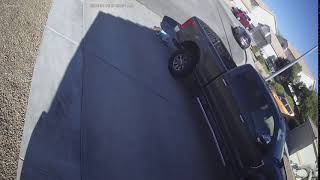Little girl accidentally runs into pickup truck (Security camera)