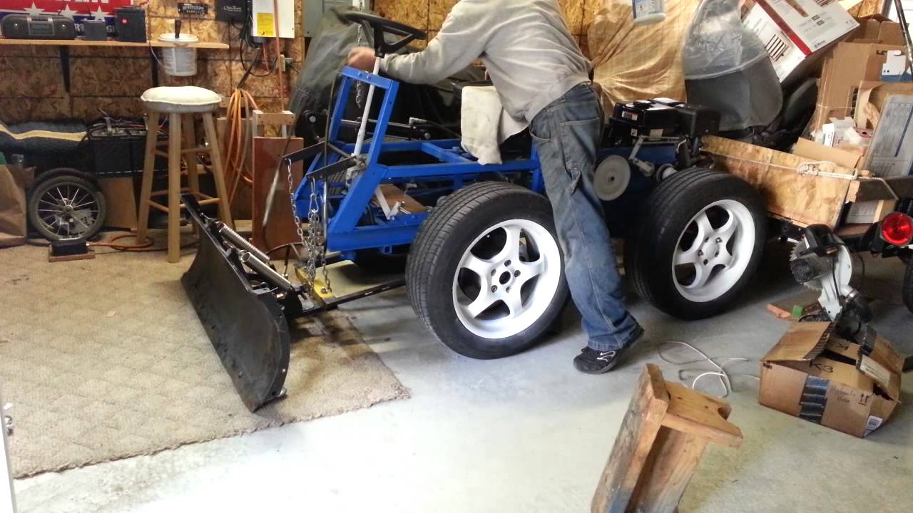 Homemade tractor first test of snow plow with power angle. - the welds were...