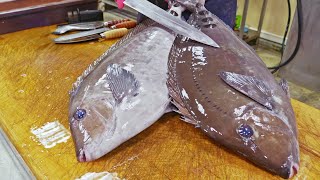 Atum e peixe preto com cauda de serra no porto,habilidades de corte de peixe,mingau de peixe