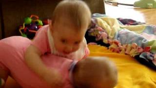 Twin babies tackle