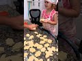 Toddler baking beignets