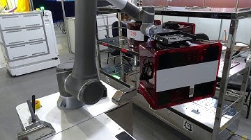 Gyro Systems Inc. Autonomous Mobile Robot (AMR) with robot arm placing FOUP