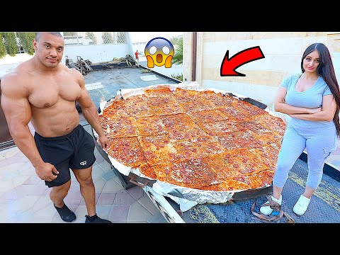 Worlds Strongest Man Eating Worlds Largest Pizza *WORLD RECORD* !!!