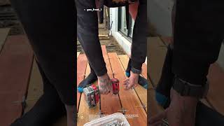 “Professional Deck Board Installation With Perfect Gap Alignment”