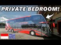 Travelling across indonesia on an ultra luxury bus in a private bedroom